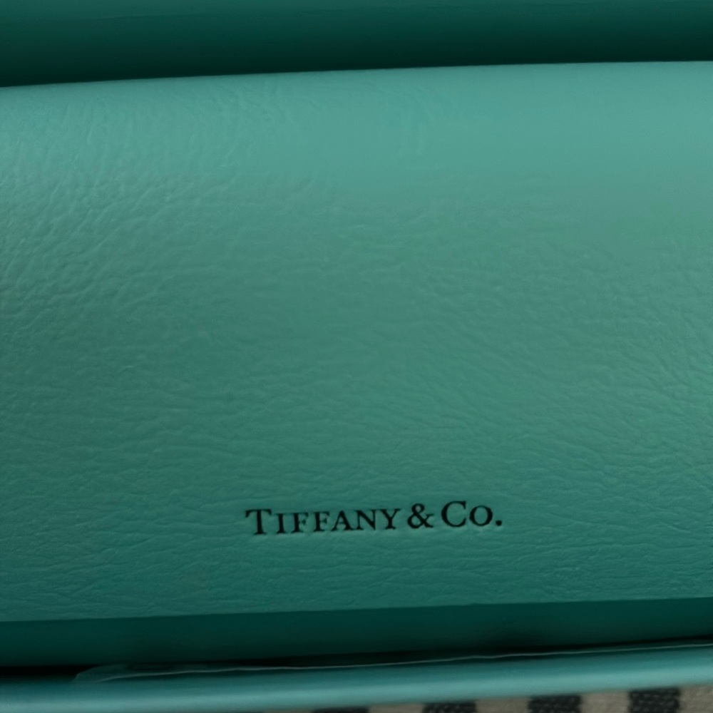 Brand new, never worn, Tiffany and Co Sunglasses made by Luxottica.